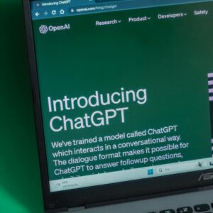 Laptop displaying ChatGPT introduction page on a web browser.